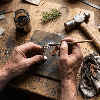 Lodester cuff receiving its antique patina by hand