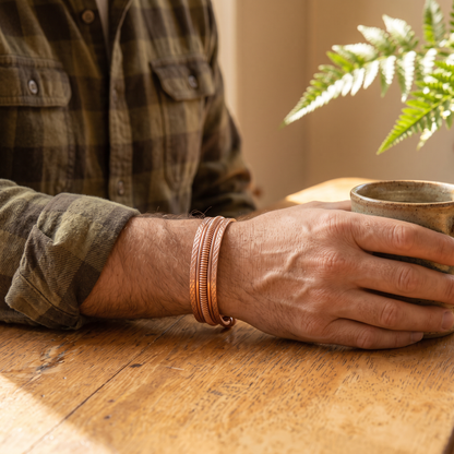 Ivory copper cuff worn by a man