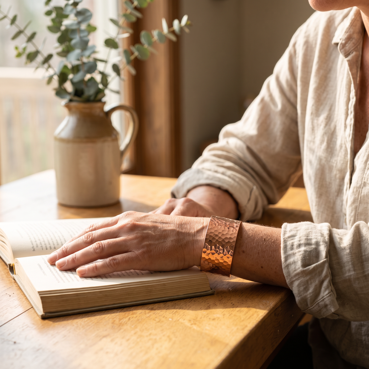 Ocean hammered copper cuff worn on the wrist