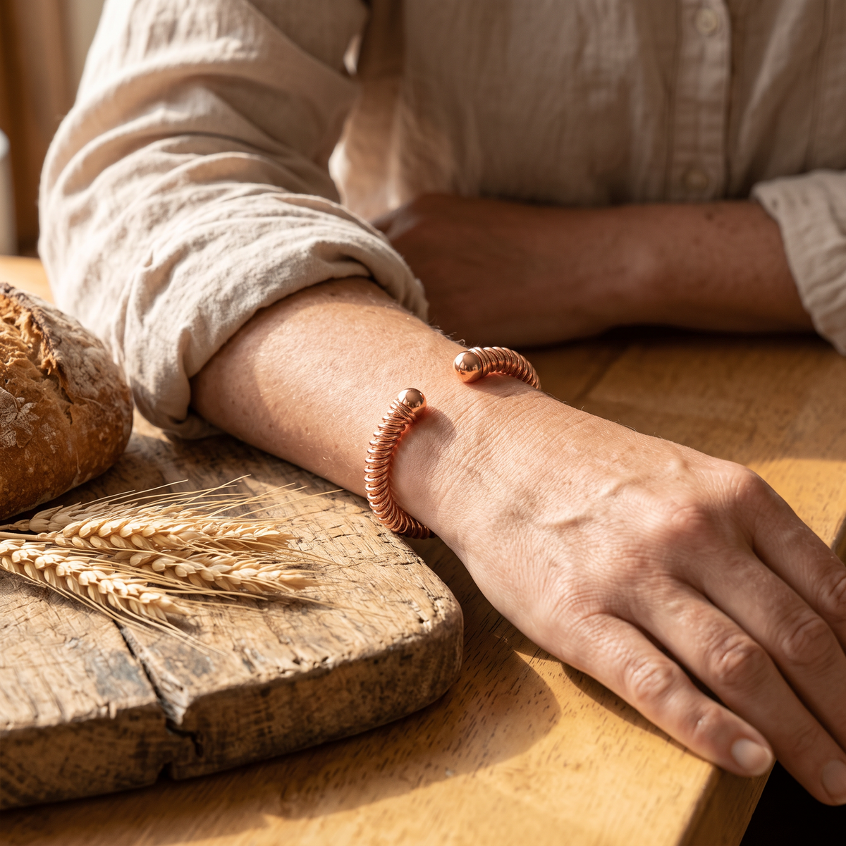Calista copper cuff worn by a woman