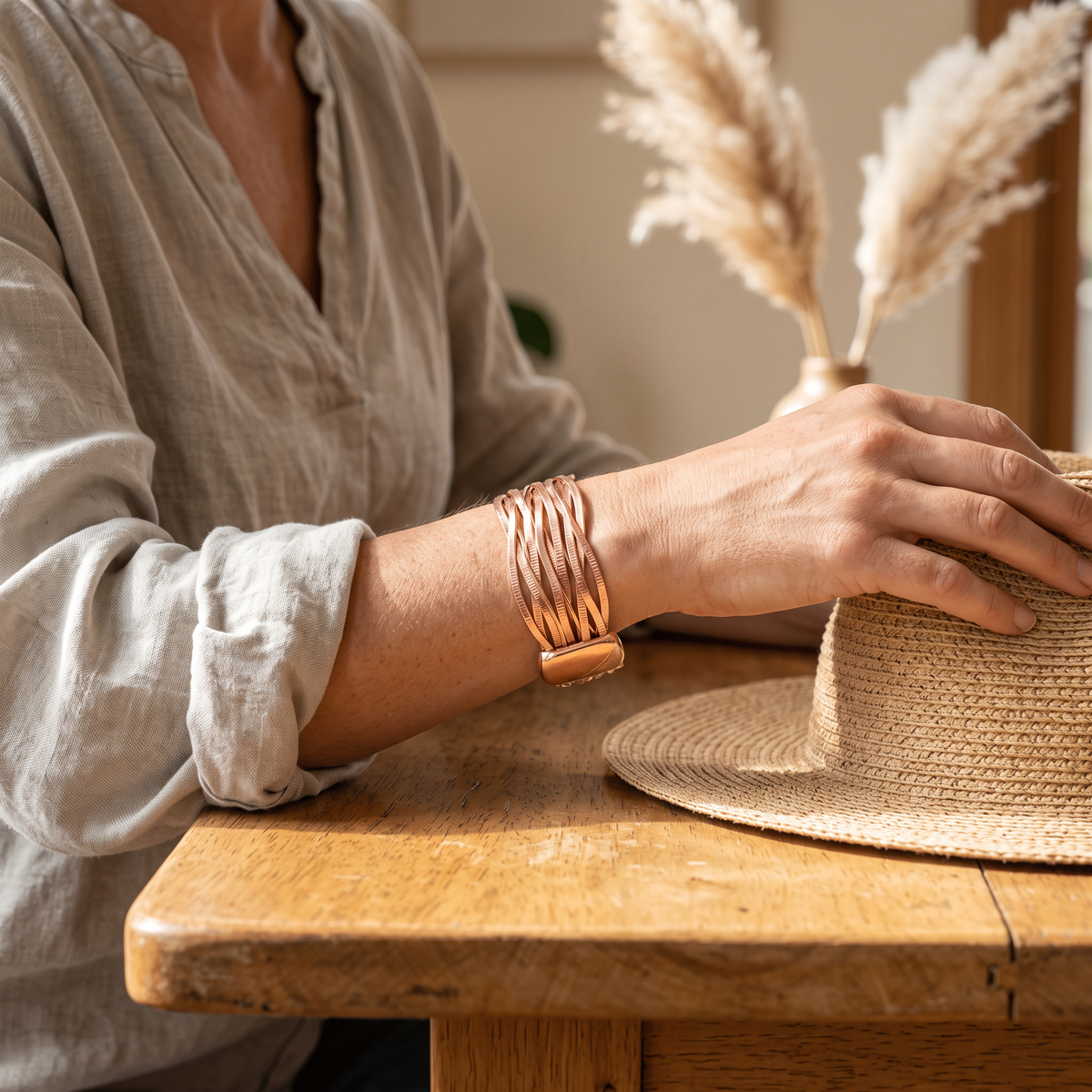 Wind copper cuff worn by a woman