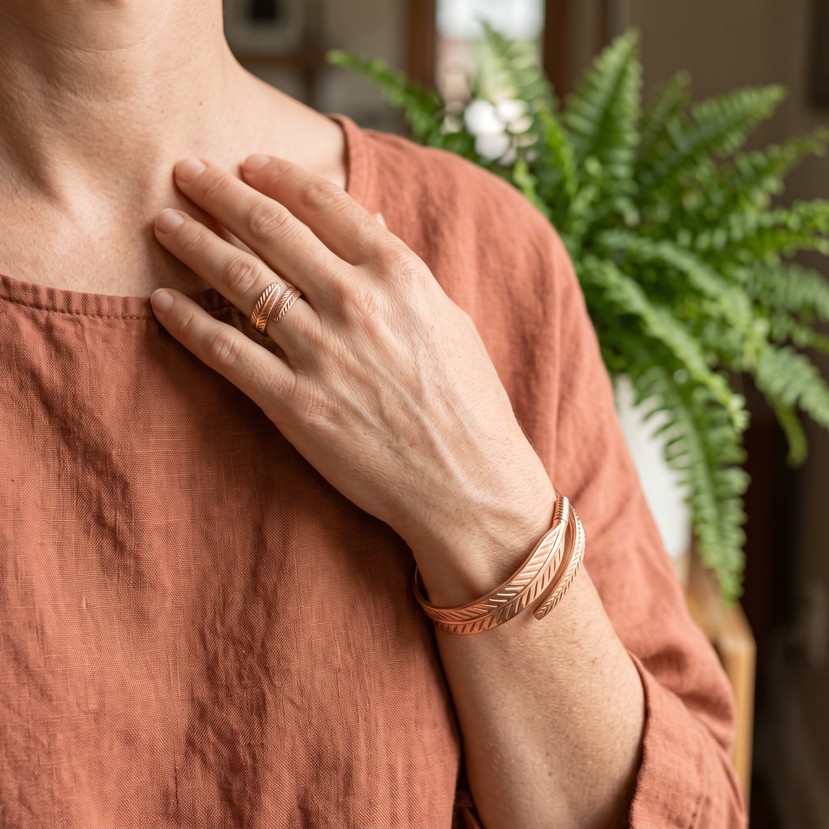 Ella's Feather Copper Set worn on wrist and finger